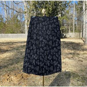 a new day Black Abstract Face Art Pleated A-Line Skirt